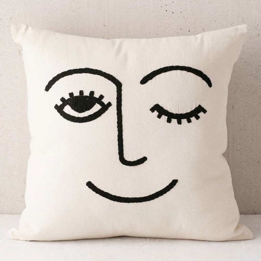SOLD Urban Outfitters off white and black winky throw pillow